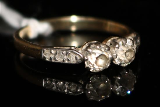 An early 20th century 18ct gold and two stone diamond ring, size P.